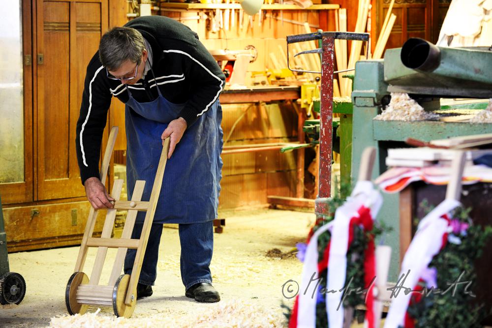hobby horse carpenter in his workshop building an easter ratchet