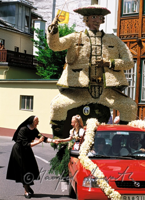 Spectator greets a participant at the Narcissus Festival