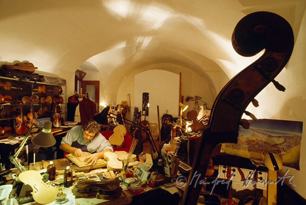 violin maker in his workshop