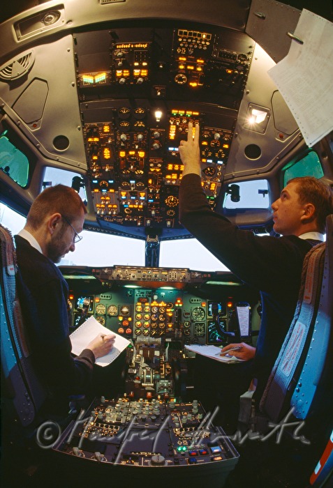 pilot and copilot in the cockpit doing the check