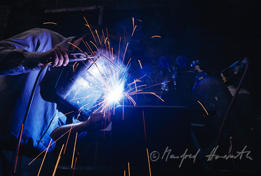 a locksmith welds metal