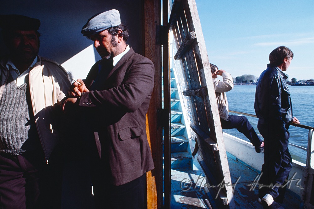 passengers on the deck of a ferry boat