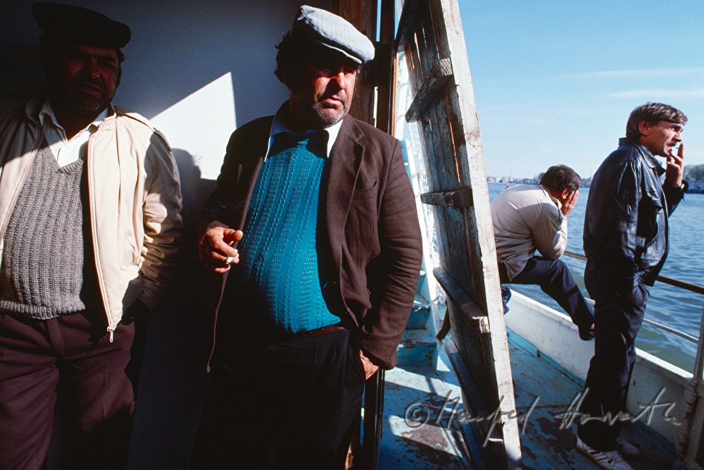 passengers on the deck of a ferry boat