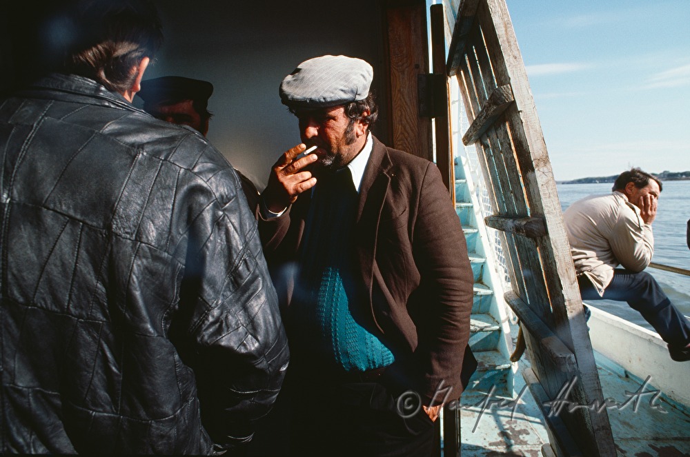 passengers on the deck of a ferry boat