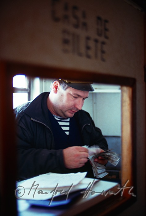 cashier of a passenger ferry counts money