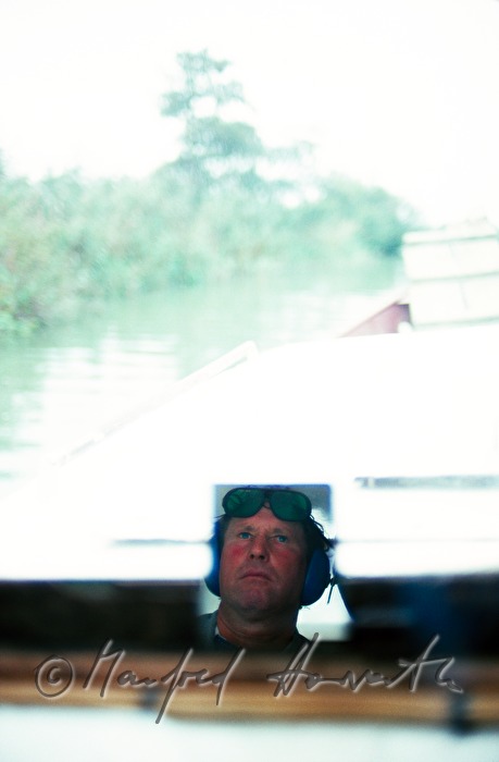 captain of a boat in the driving mirror