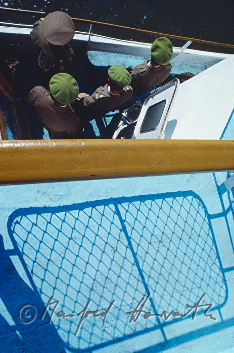 passengers on the deck of a ferry boat