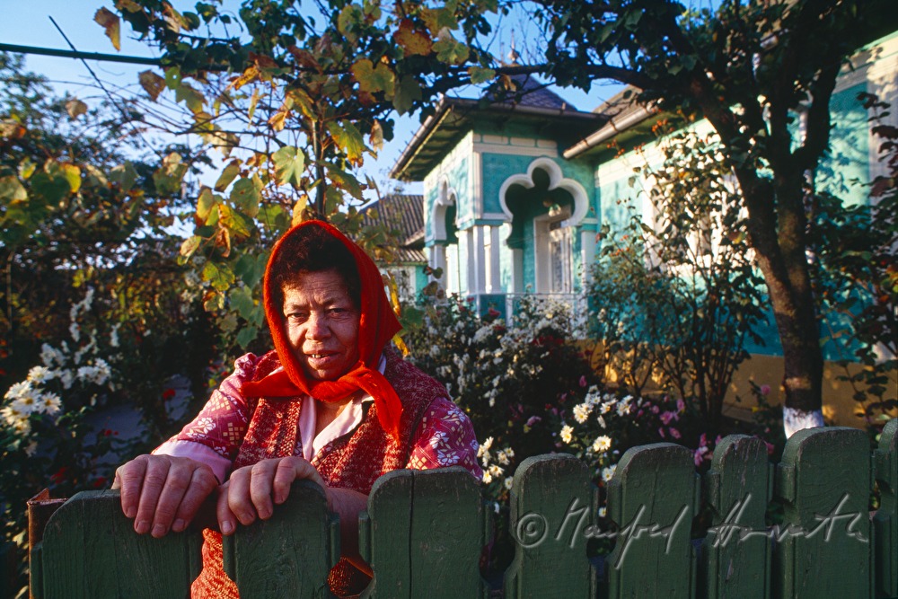 Lipovan woman in front of her house