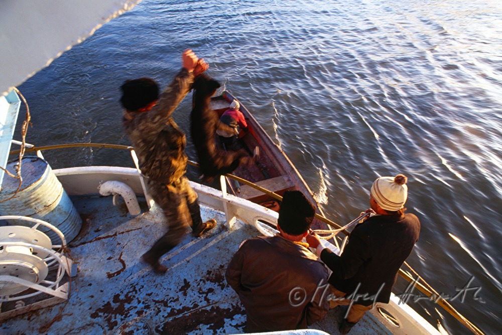 passengers on the deck of a ferry boat