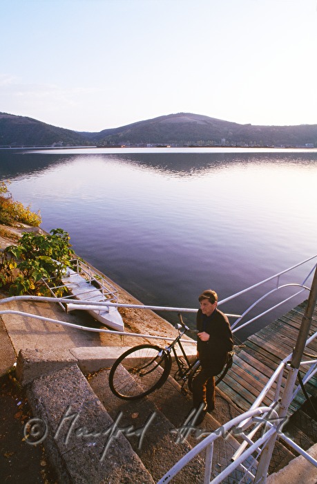 sailorman comes to shore with a pushbike