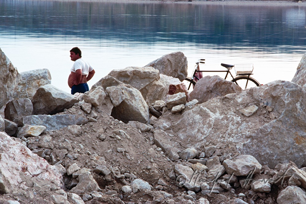 bicyclist makes a break on the shore of the Danube