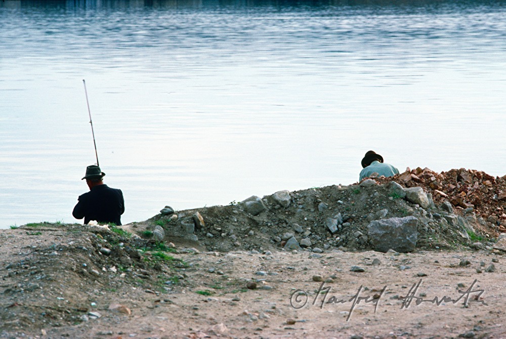 fishermen on the shore of the Danube
