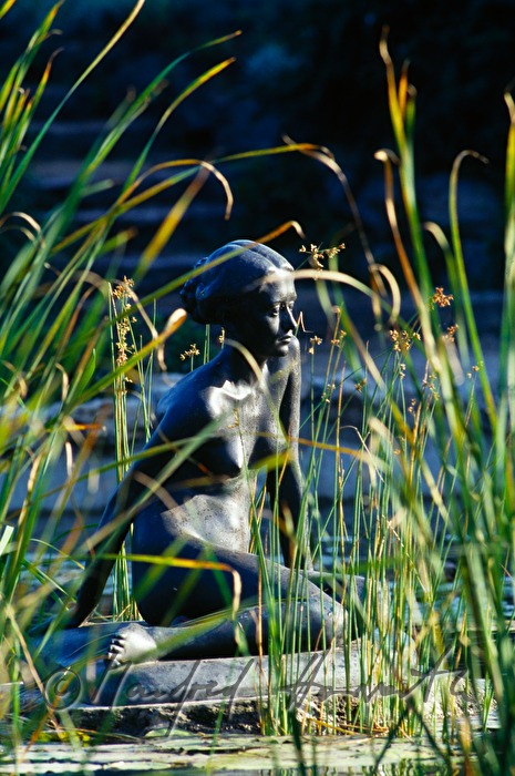 statue of a bathing woman in a fountain