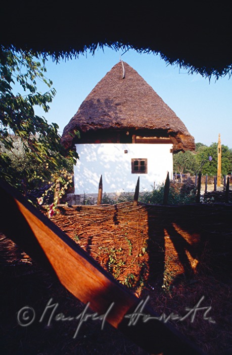 gothic bellfry with thatched roof from the village Mánd