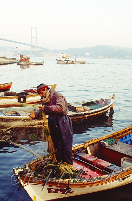 fisherman cleaning the net