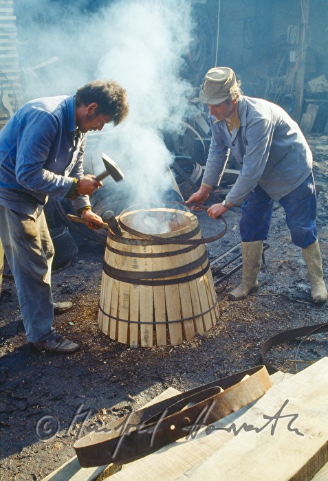 coopers making a barrel