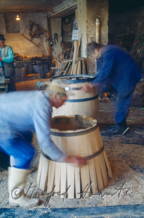 coopers making a barrel