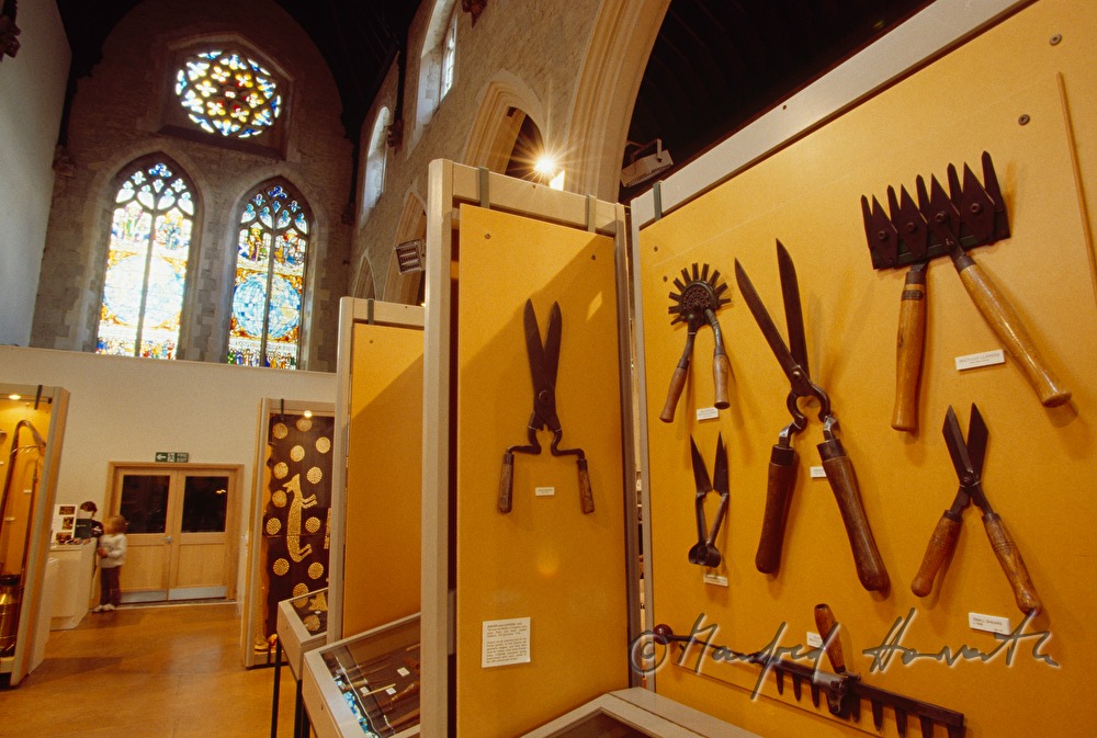 showcase with historic gardening tools