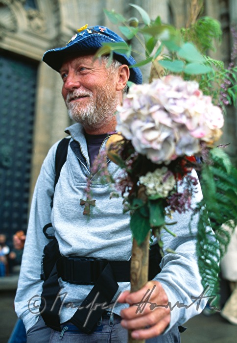 pilgrim with decorated hiking pole