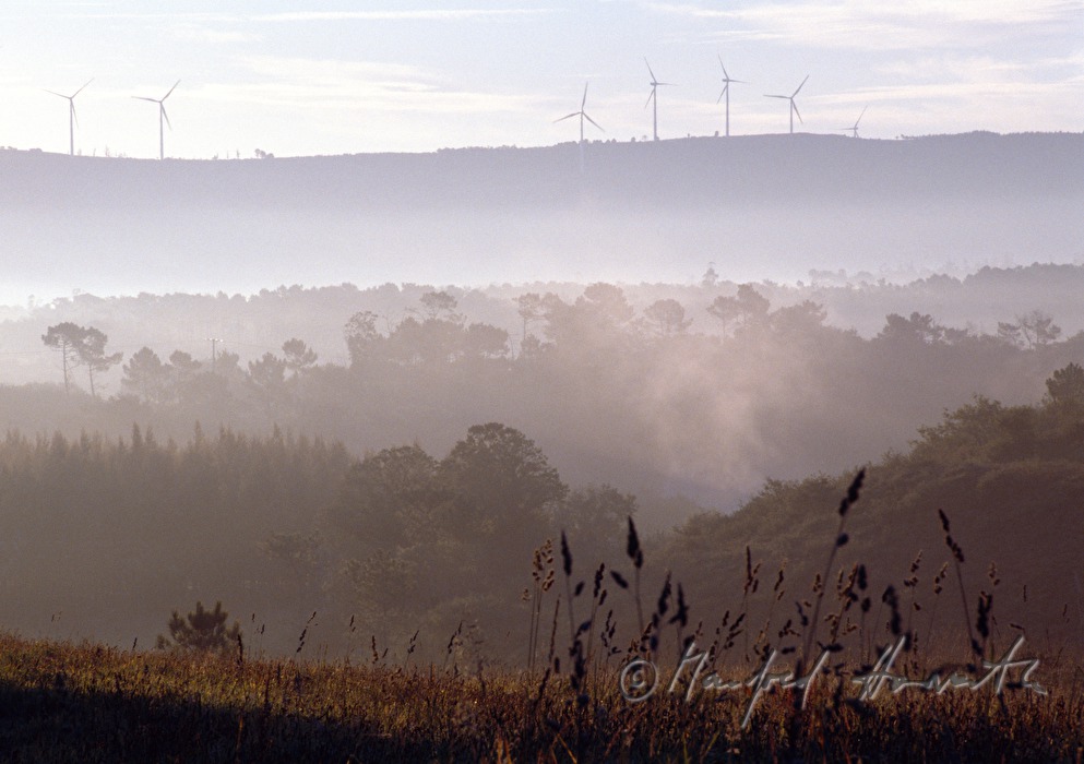 wind mills on a mountain ridge near Olveiroa
