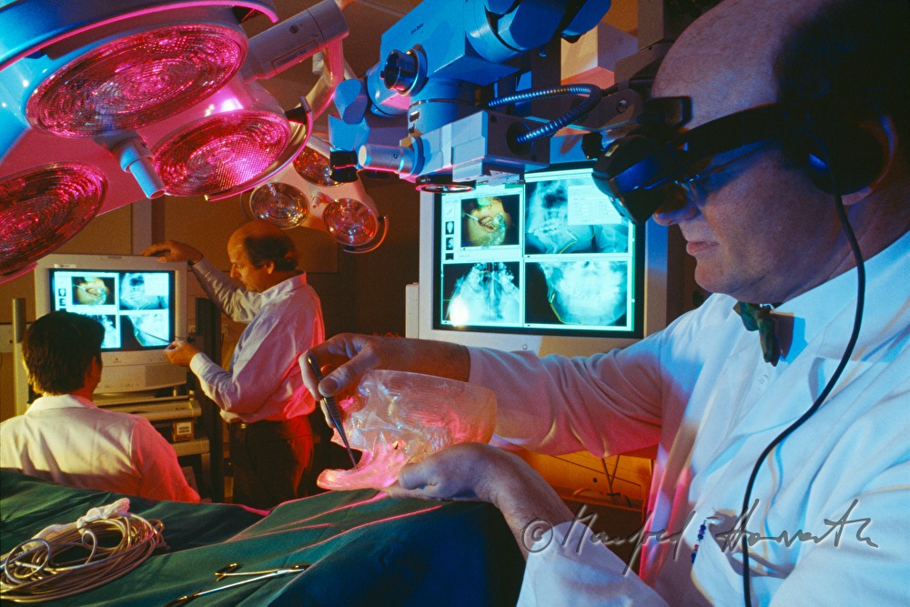 oral surgeon doing a virtual operation for students