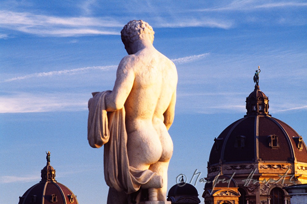 statue on the roof of the parliament