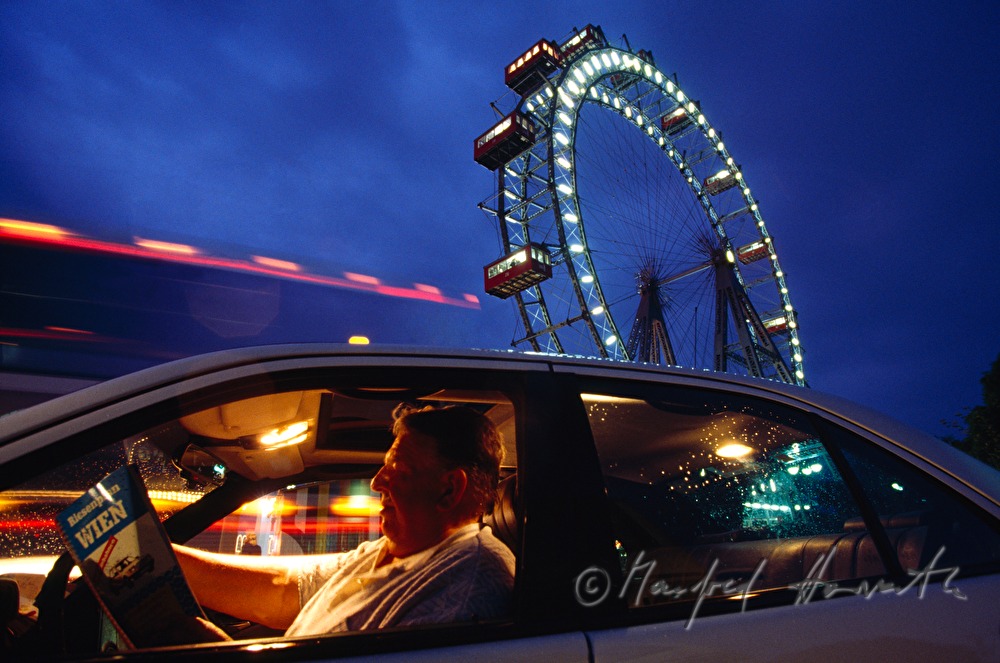 taxi driver in front of the Wiener Riesenrad