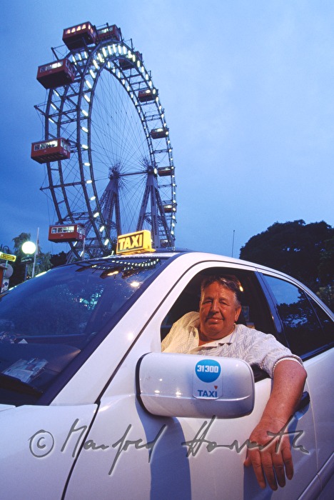 taxi driver in front of the Wiener Riesenrad