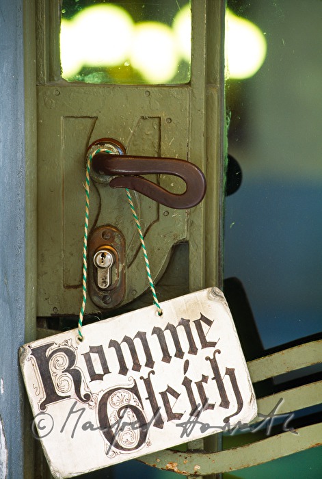 doorplate on the entrance of an antique shop