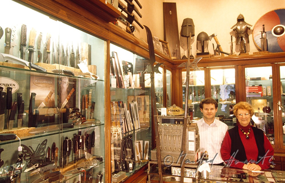 the owners of the shop at the desk