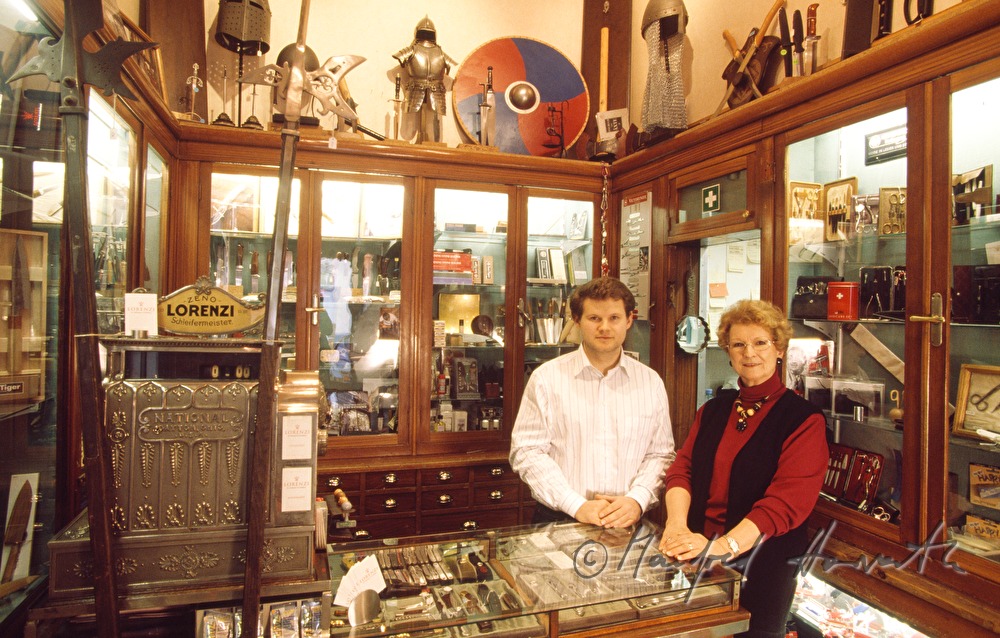 the owners of the shop at the desk