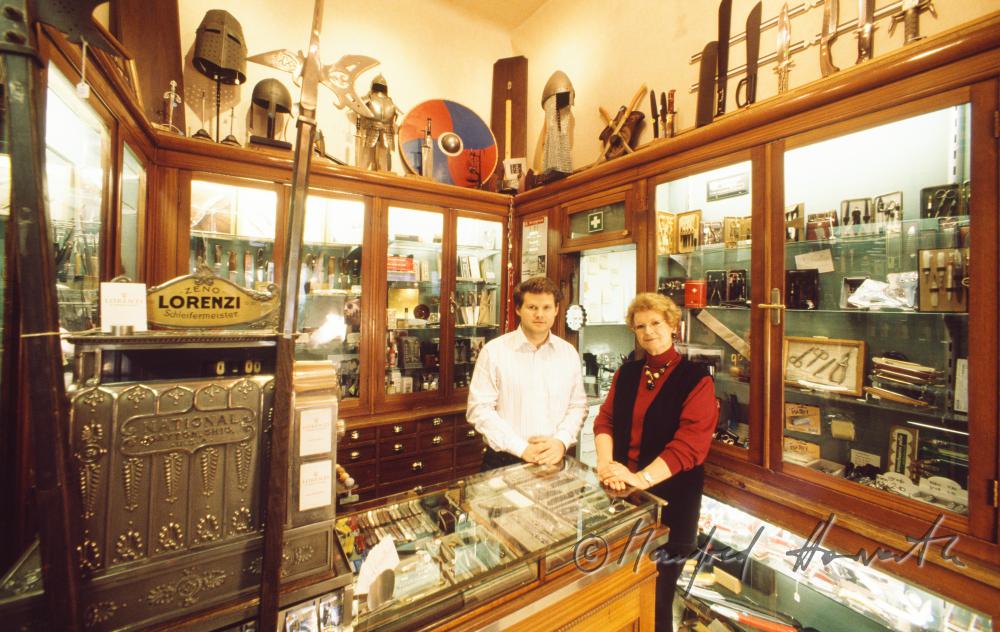 the owners of the shop at the desk