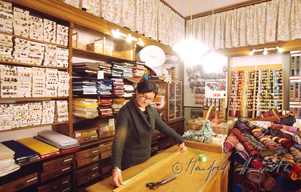 Irene Herbert measuring a textile bordure