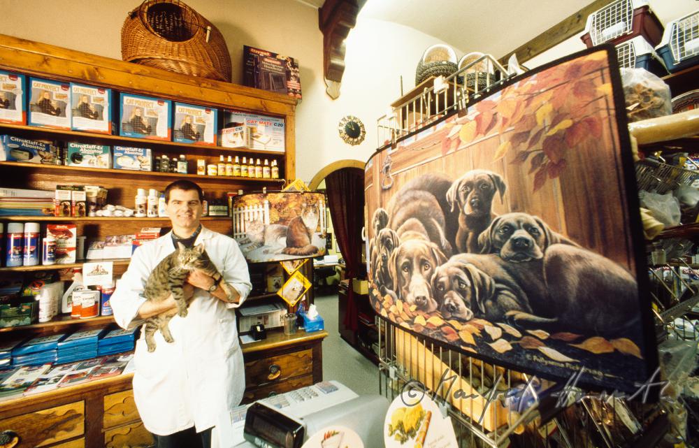 the owner of the shop with a cat