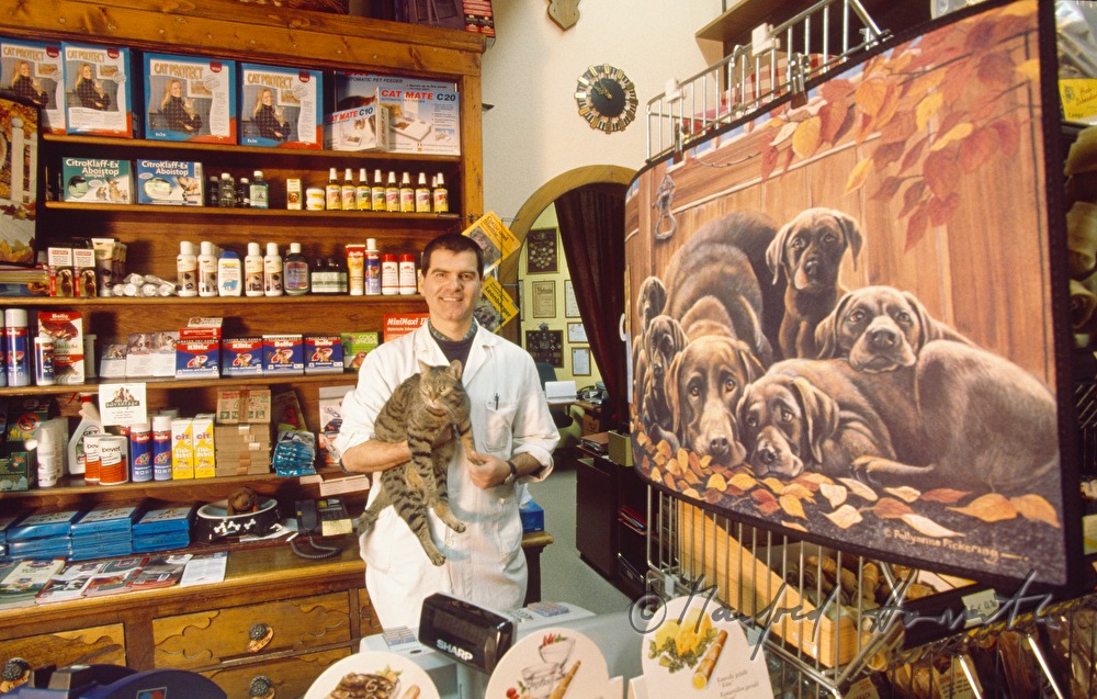 the owner of the shop with a cat