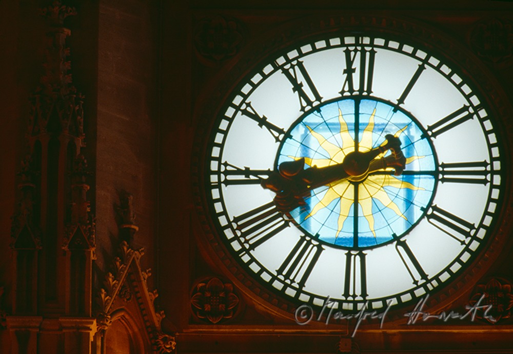 clock on the tower of the town hall