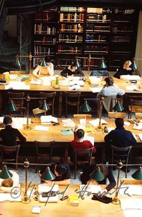 students in the reading room of the library