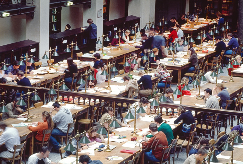 students in the reading room of the library