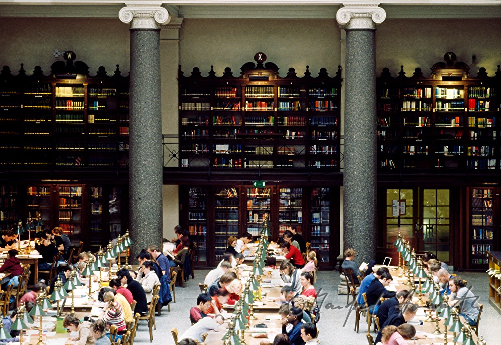 students in the reading room of the library