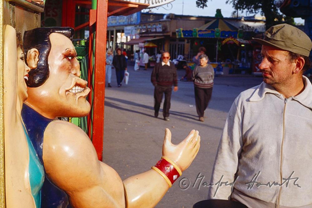a visitor checks the strength of the punching doll