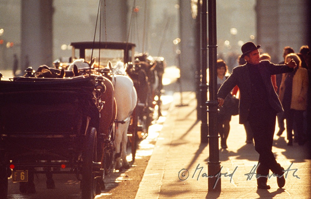 Fiaker advertising for a ride with his carriage