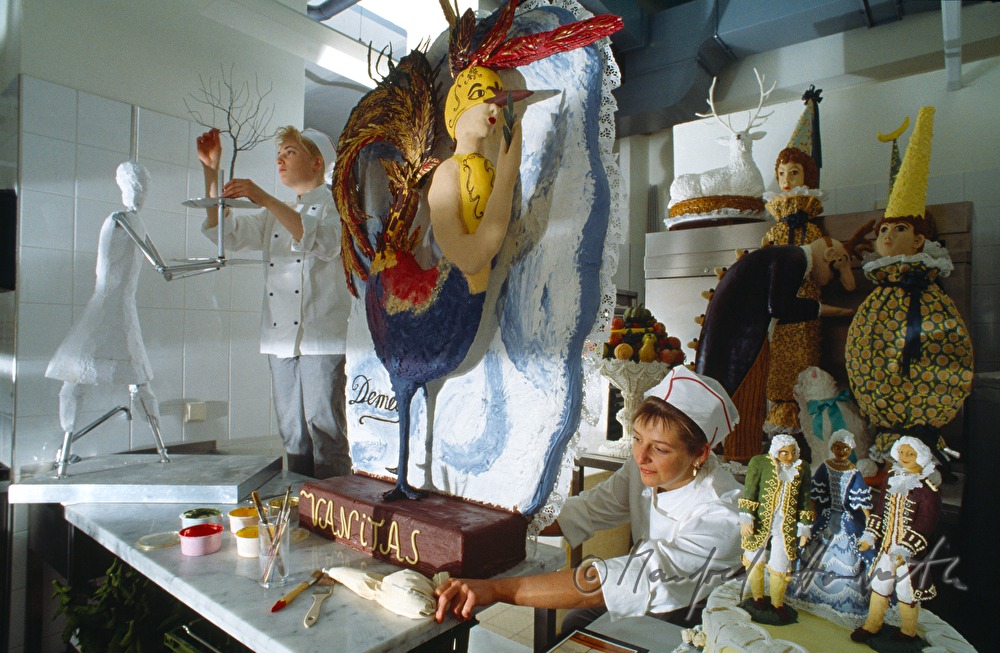 women pastry cooks preparing special cakes in the confectionary