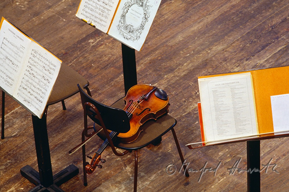 violin and music stand during an orchestra break