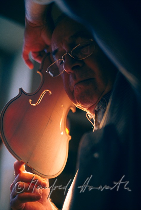 violinmaker with lid of violin