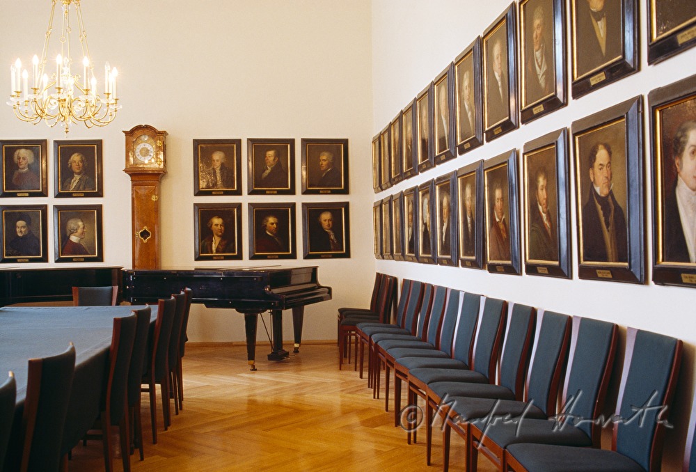 conference room with piano and paintings