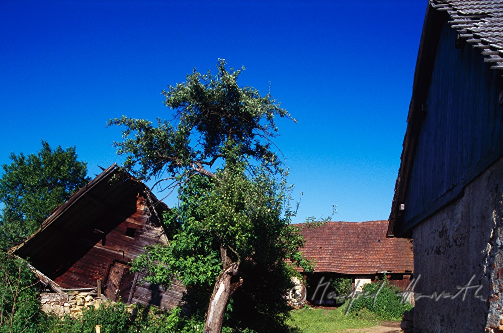 farm with overthrown barn