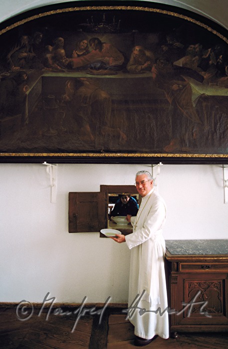 dinner hall, friar gets lunch from kitchen window