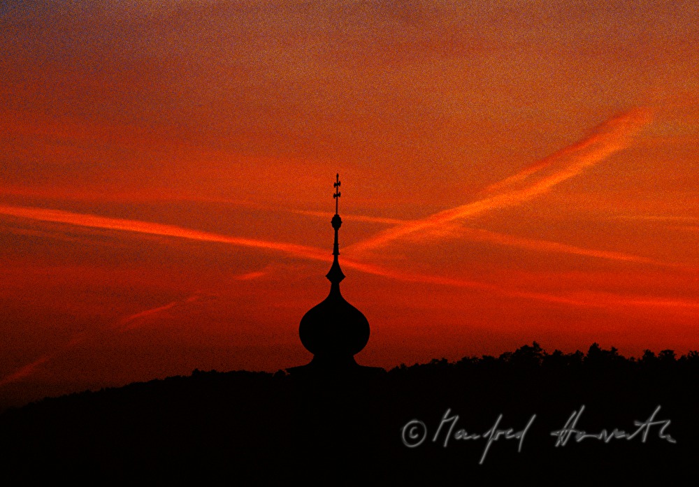 steeple of Spitalkirche and silhouette of Leithagebirge