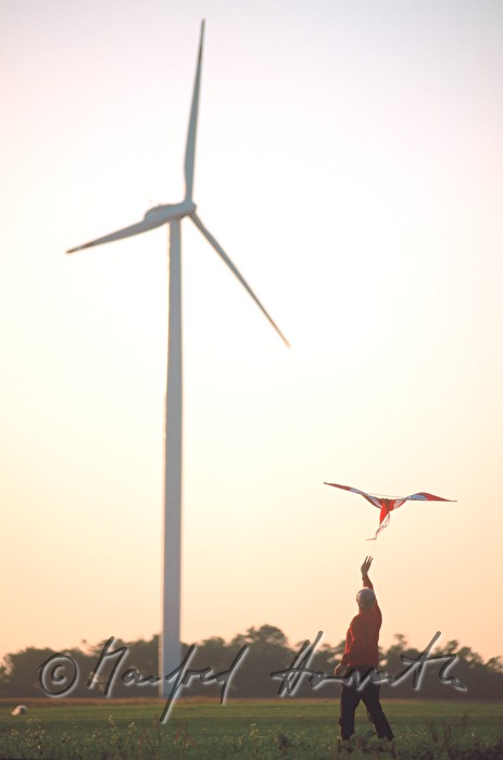 man flying a kite in the windpark