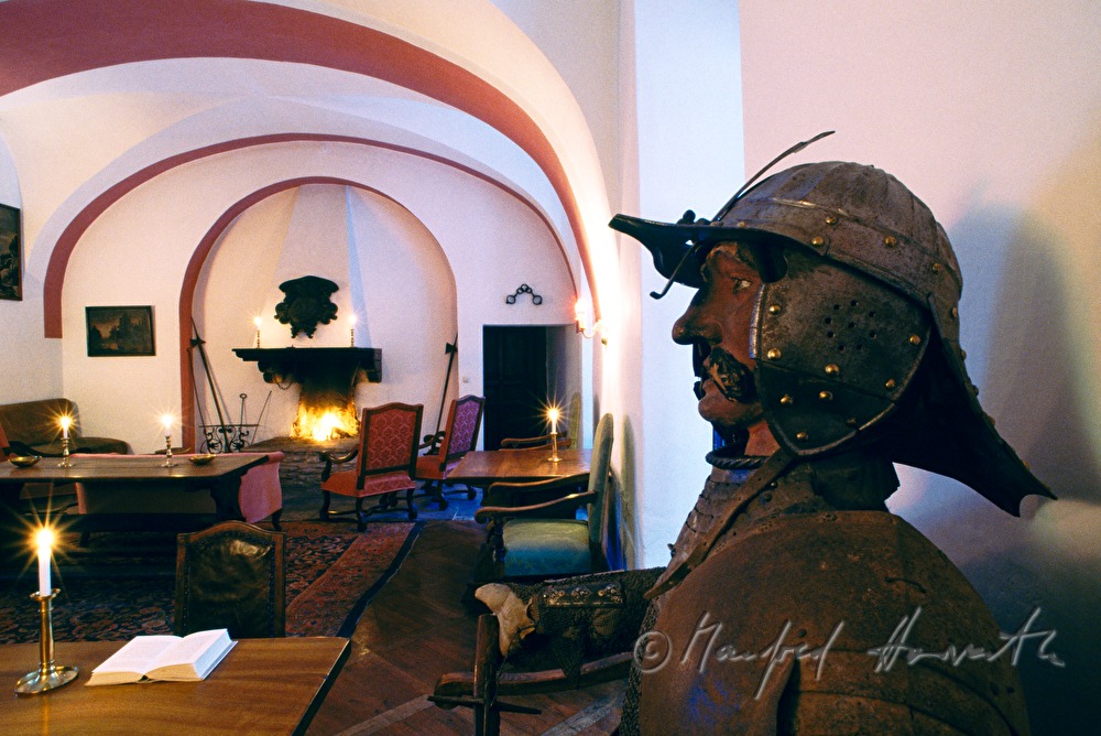 fireplace room with knight's armor